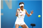 BIRMINGHAM, ENGLAND - JUNE 13:  Kimiko Date-Krumm of Japan in action against Casey Dellacqua of Australia during Day Five of the Aegon Classic at Edgbaston Priory Club on June 13, 2014 in Birmingham, England.  (Photo by Jordan Mansfield/Getty Images for Aegon)